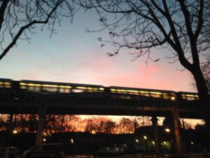 photo of bridge with sunrise lighting in the background