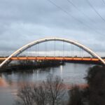 lit bridge over river