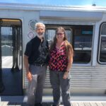 Barry Glicklich and Katherine Lato in front of EL train on Google's roof